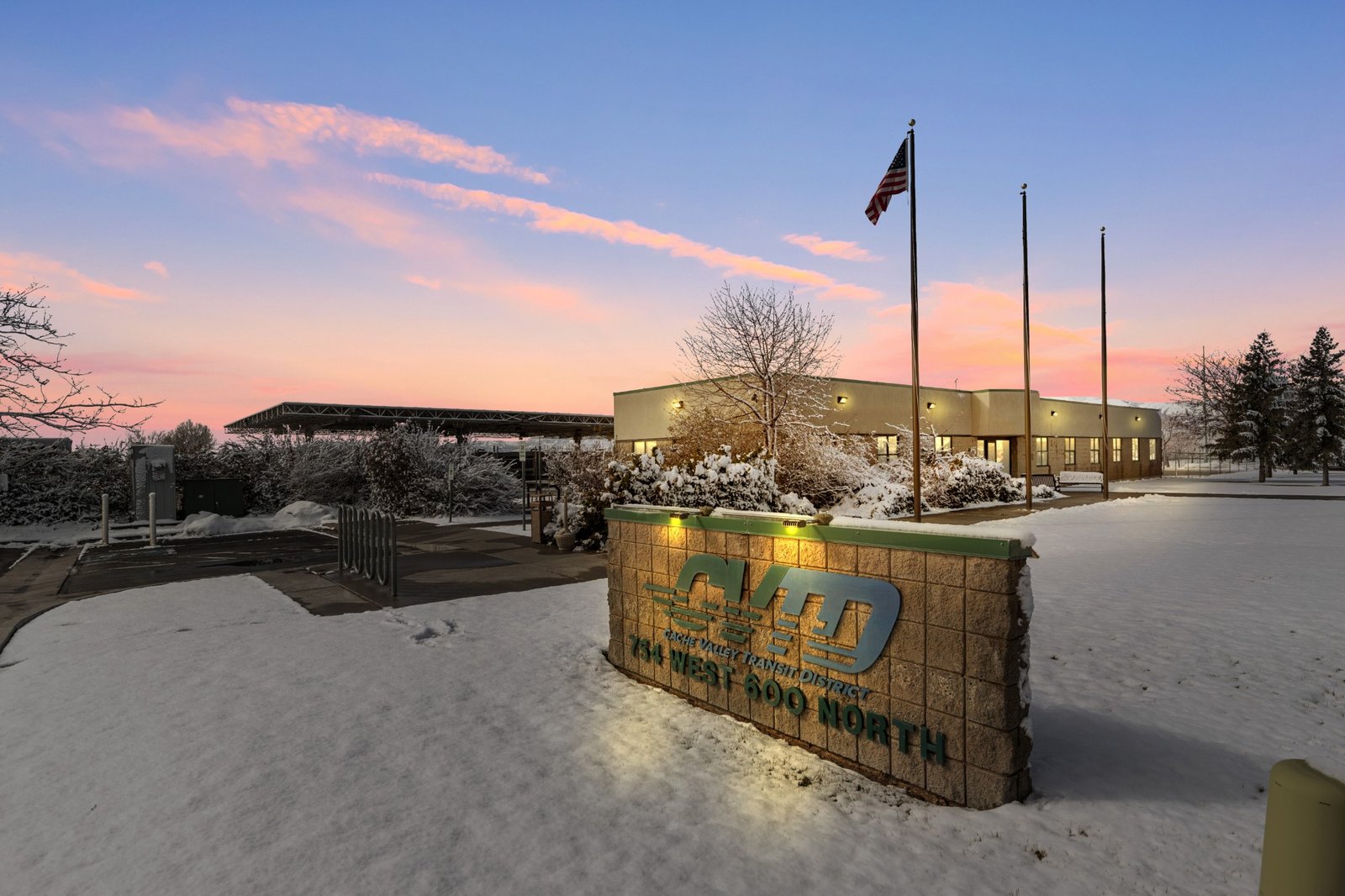 A commercial building in Logan, Utah at sunset in the snow
