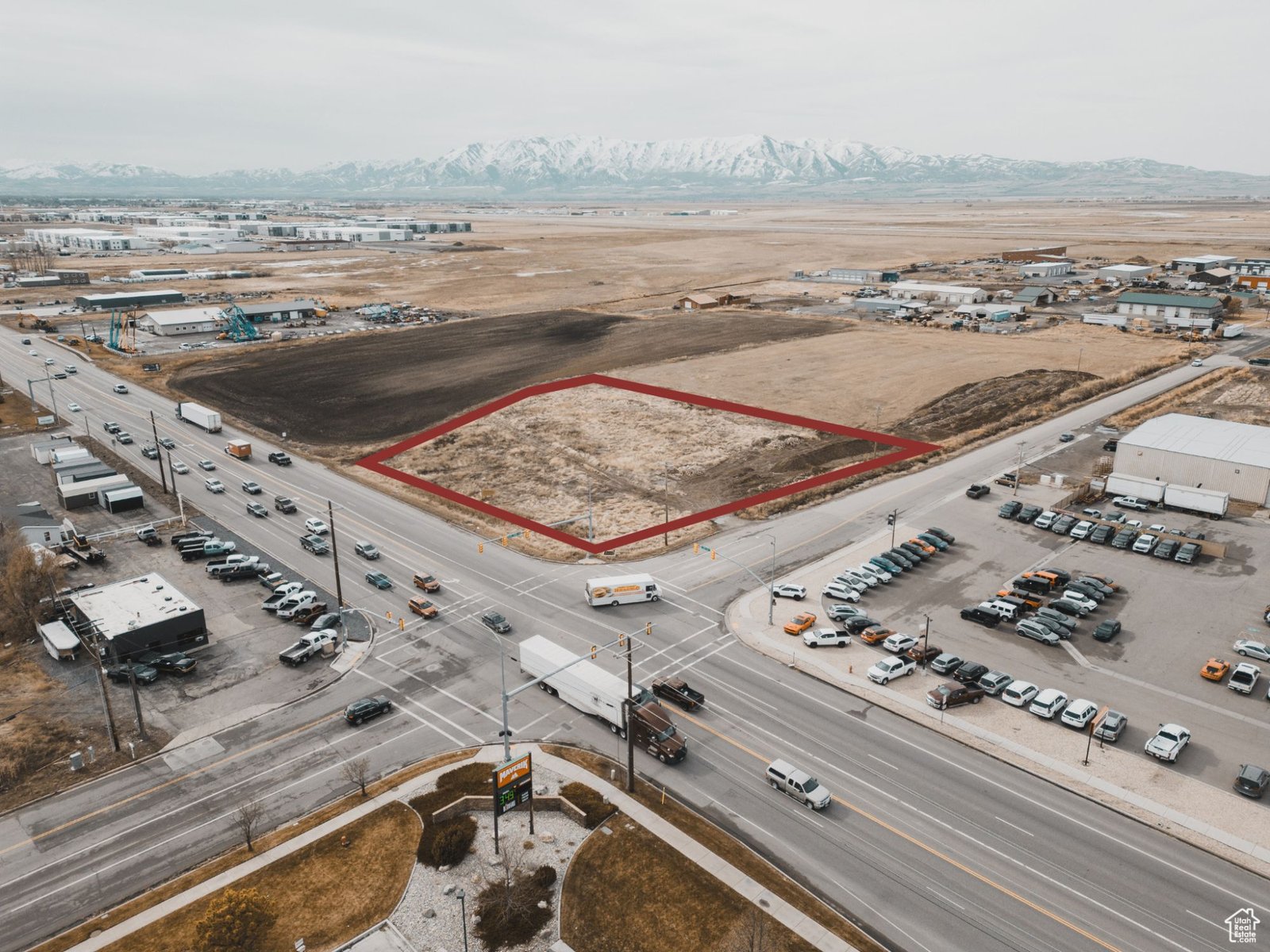 Aerial view of a two-acre commercial corner on Highway 91 in Hyde Park, outlined in red
