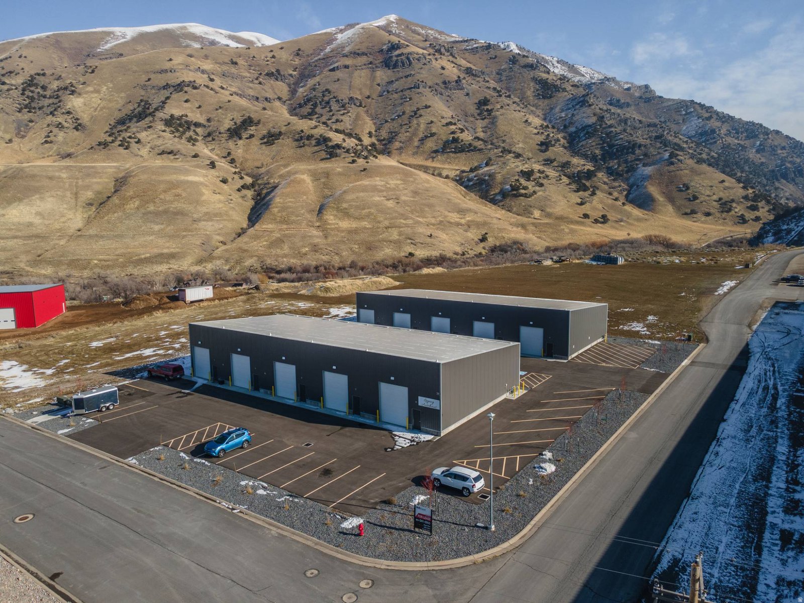 Aerial view of the two Hyrum Flex buildings with the mountains behind